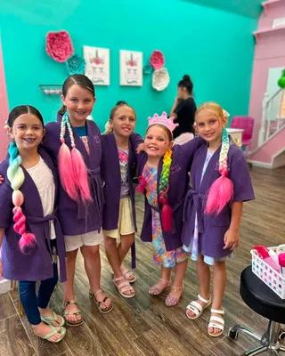 Child with braided, shimmery mermaid tail hair extensions