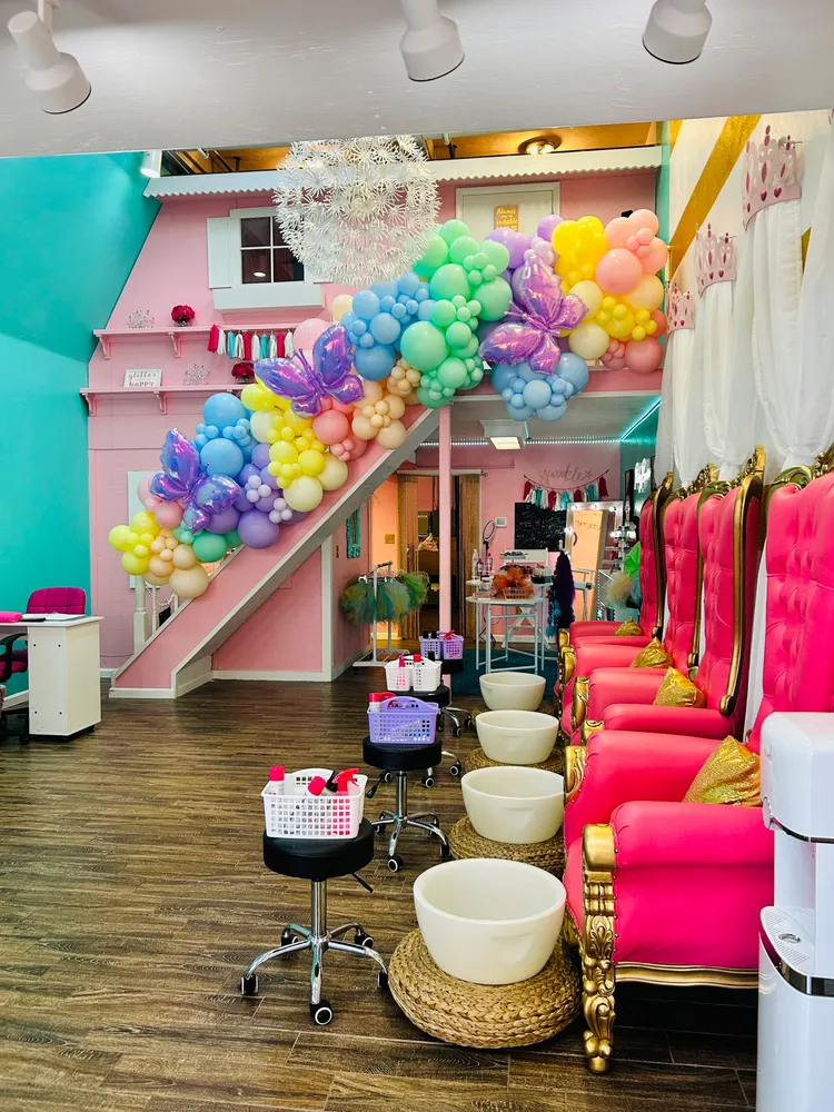 Inside Trinity's Day Spa: pink throne pedicure chairs and pastel balloon decor
